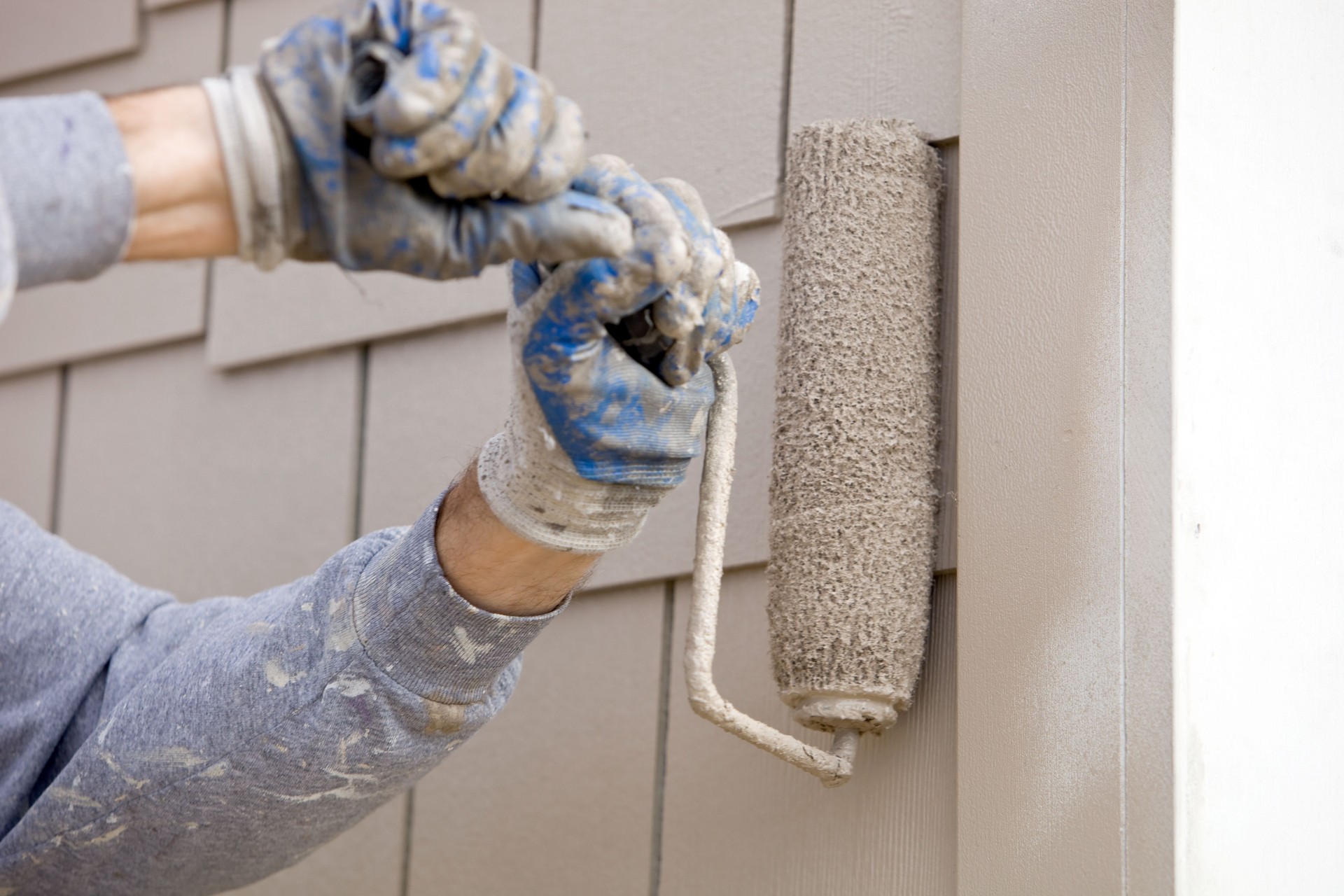 House Painter Roller Painting new Siding
